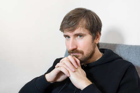 Portrait of a male psychologist in an office. The concept of healthcare, addiction. Social problems.の写真素材