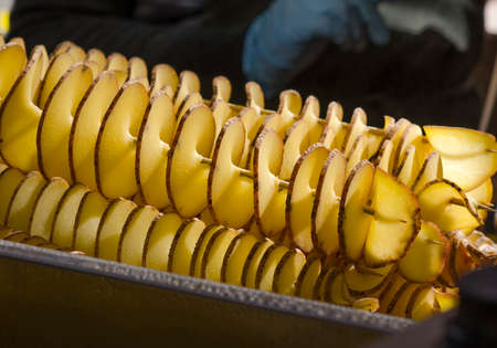 Juicy potato in the form of a spiral.の写真素材