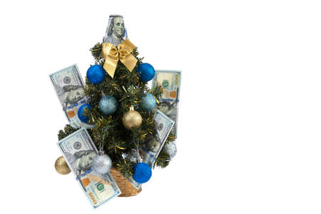 Christmas tree with dollars on isolated white background.の写真素材