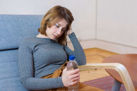 A young woman in a psychologists office talks about her problems. Psychological treatment.の写真素材