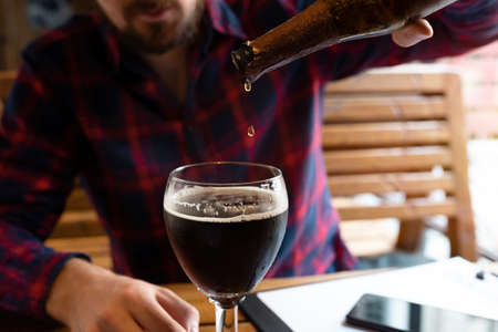 Alcohol and unhealthy lifestyle concept. Fight against alcohol addiction, loneliness, crisis, dismissal, unemploymentの写真素材