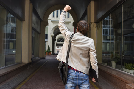 An employee of the office center was dismissed from his job, on strike in the street against the background of an office building. The unemployment rate is growing due to the global economic crisis. Unemployment conceptの写真素材