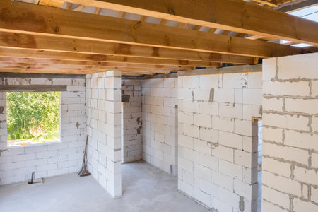 New construction of a residential building under construction. Interior view of the construction of a cottage house.の写真素材