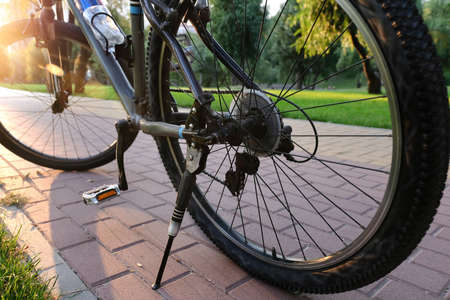 Bike on the road of the city park, close-up. Bicycle concept and ecology of life.の写真素材