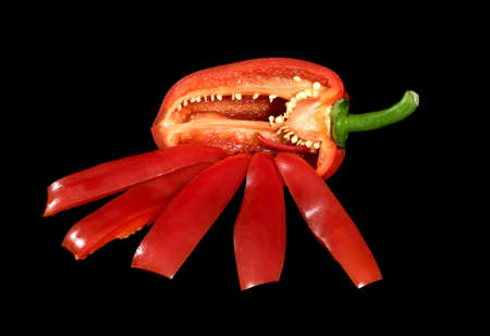 Red pepper is isolated on a black backgroundの写真素材