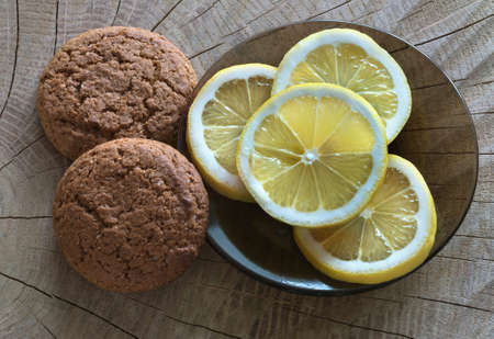 Fresh lemon, cookies close up, top view.の写真素材