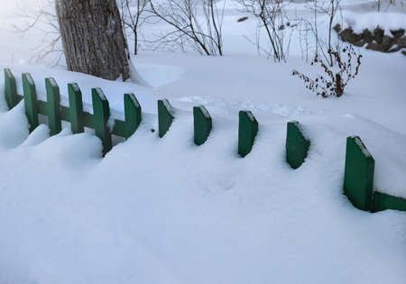Road is covered by snow in winter outdoors.の写真素材