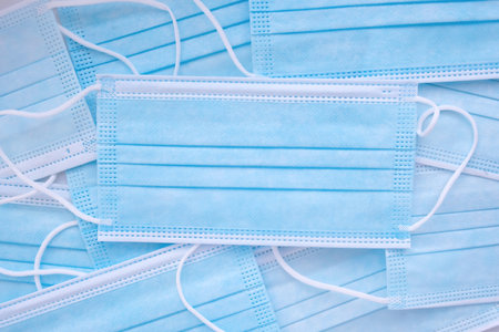 Medical protective face masks on the table. Disposable Surgical Face Mask, Virus Protection.