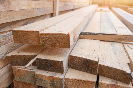 Storage of wooden planks at the sawmill. Sawing and drying of wood. Industrial background. Lumber Industry.の写真素材