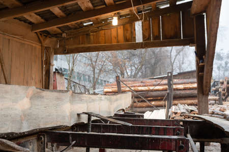 Sawmill cutting log process of making wood planks lumber and timber industry. Lumber Industry.の写真素材