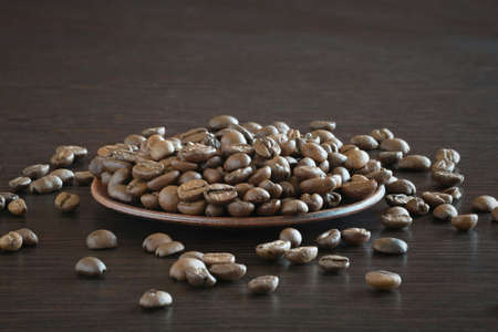 Coffee beans on a wooden background.の写真素材