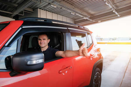 A man drives into an underground car park. Parking security system