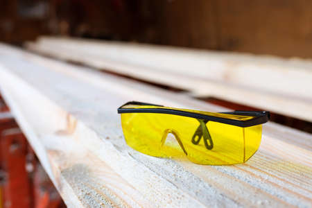 Construction glasses in the sawmill warehouse. timber industry.の写真素材