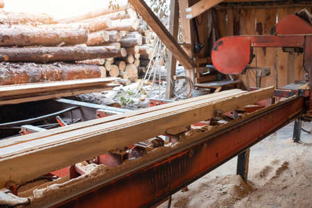 The process of processing wood at an old sawmill. Timber industry
