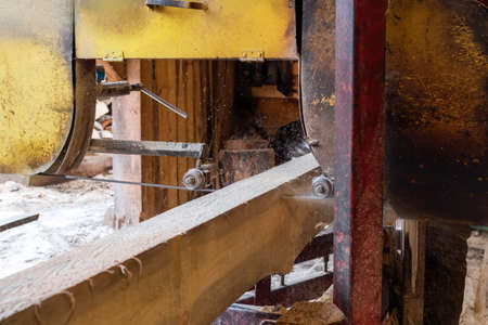 The process of processing wood at an old sawmill. timber industry.