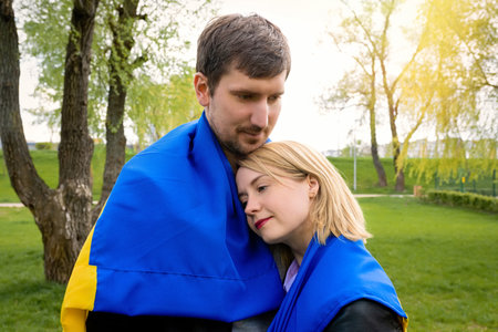 Happy people together with ukraine flag in the park. Free lifestyleの写真素材