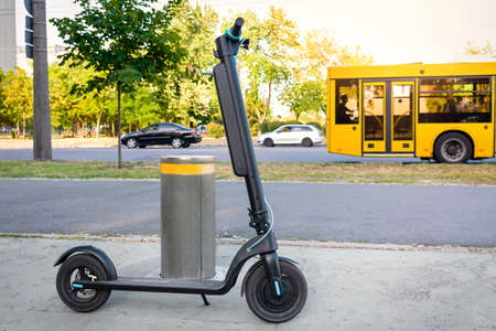 Electric scooter on the city street road. Eco-friendly transportの写真素材