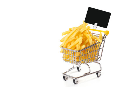 Potatoes in supermarket trolley with price tag isolated on white background. Cooking conceptの写真素材