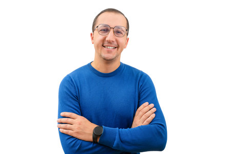 Young man in glasses looking at the camera on a white backgroundの写真素材