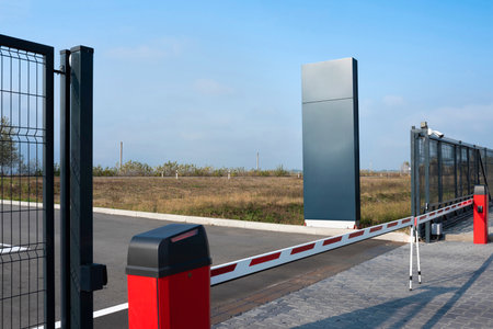 Closed automatic gate of the barrier. Automatic security system for private areas. Automatic entry system, parking barrierの写真素材