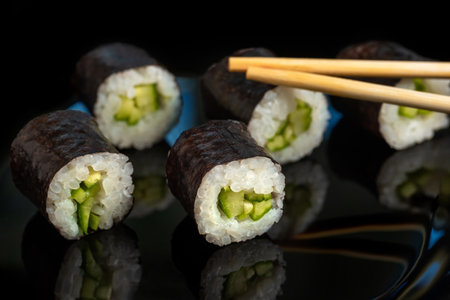 Japanese fresh sushi rolls with seaweed on a black background.の写真素材