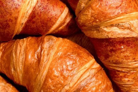 Fresh French croissants close-up. Homemade baking backgroundの写真素材