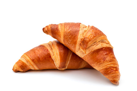 Fresh croissants on a white background close-up. French pastriesの写真素材