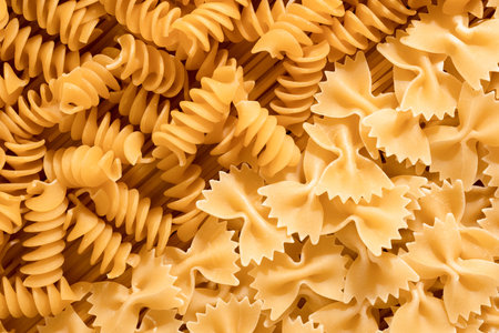 Food background of raw italian pasta close up, top viewの写真素材