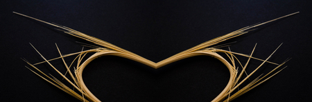 Broken bars on a black background, heart and wings