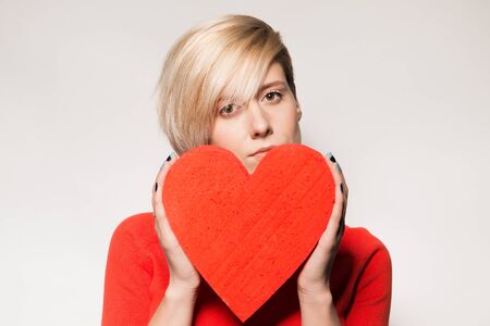 Girl holding a heartの写真素材