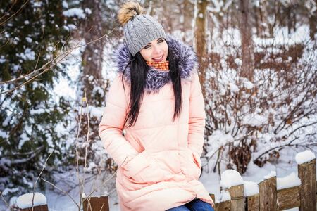 Close-up of a woman having fun in a winter parkの写真素材