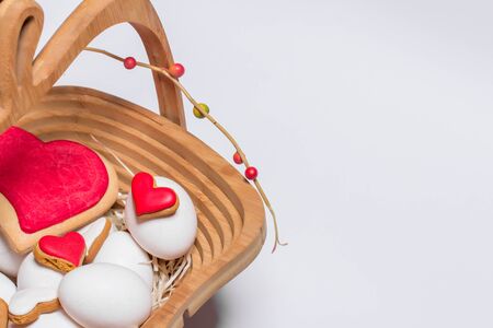 Easter card with eggs and biscuits in the form of heart. Close-up