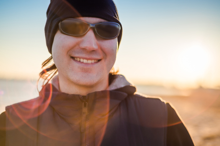 Man in sports clothes smiling outdoors. close-upの写真素材