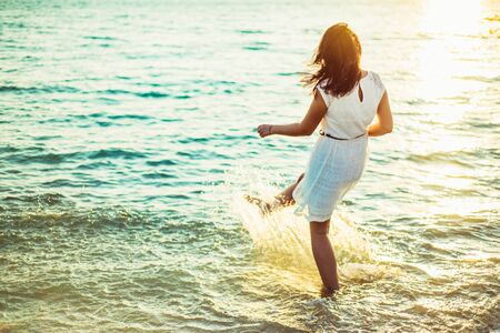 Splashing in the sea. Close-up with legs