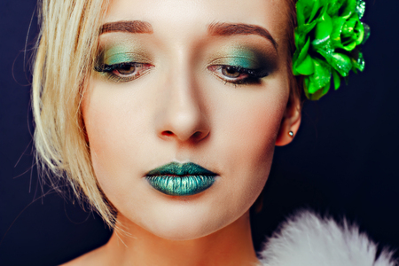 Girl with short hair and green makeupの写真素材