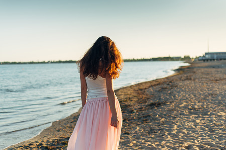 Woman with long hair at sunset close up