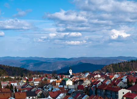 Sweet little town in mountain region surrounded with forest.の写真素材