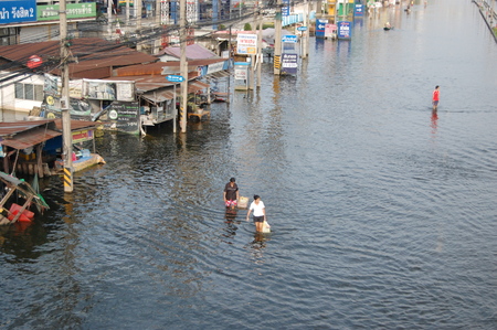 Thai People are walking though the flood  2011のeditorial素材