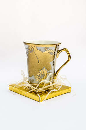 Gold Glass isolated on whiteの写真素材