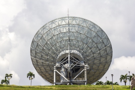A photography of a sattelite dish and white cloudの写真素材