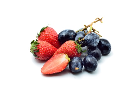 Strawberries and grapes isolated on whiteの写真素材