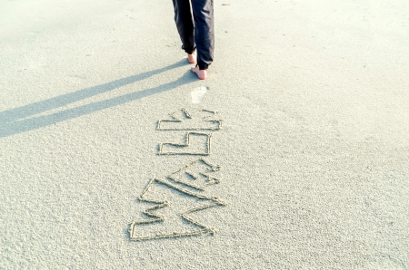 someone walking on the sand of a beachの写真素材