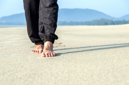 someone walking on the sand of a beachの写真素材