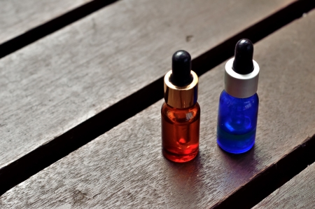 Essence oil on wooden tableの写真素材