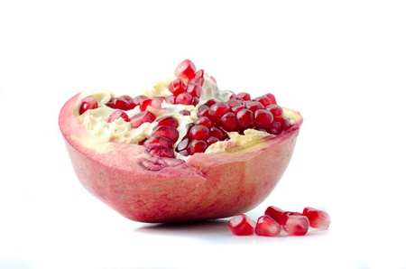 Ripe pomegranate fruit isolated on white backgroundの写真素材