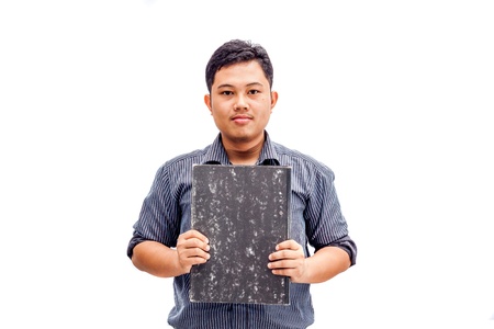 Young businessman holding grey file folderの写真素材