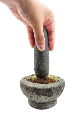 hands with a pestle and mortar on whiteの写真素材