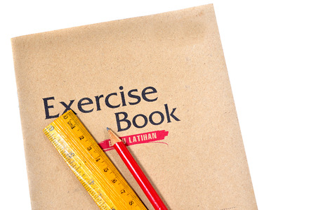 Exercise book with ruler and pencil