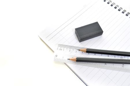 Blank page with pencils, eraserand ruler isolated on white background