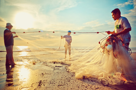 KUANTAN, MALAYSIA - 17 NOV 2012 - Fishermen do their work near Beserah beach, Kuantan, Malaysia at 24 Oct 2012. Fishermen are the main occupation for villagers at Kuantan village, Pahang.のeditorial素材